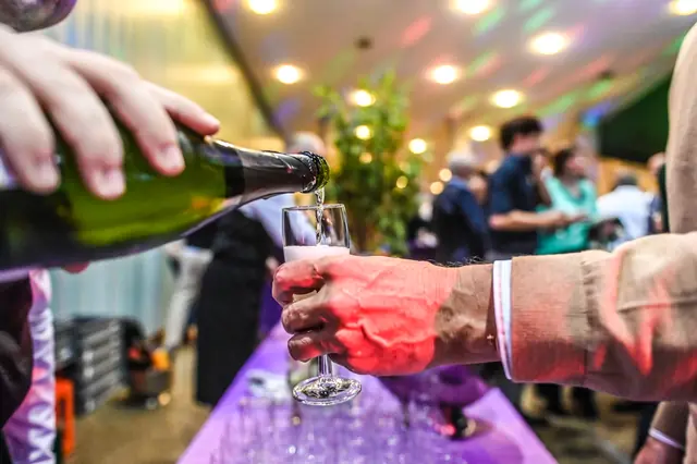 Bubbly being poured into a glass.
