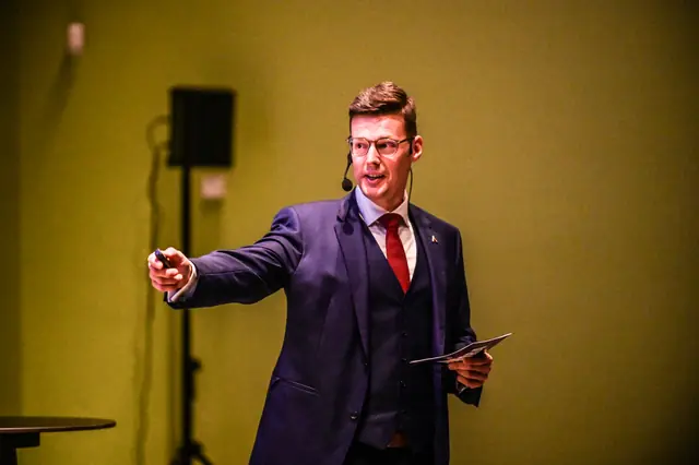 A host opening the evening on stage.