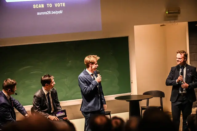 The stage under the “Scan to vote” screen of the live poll.