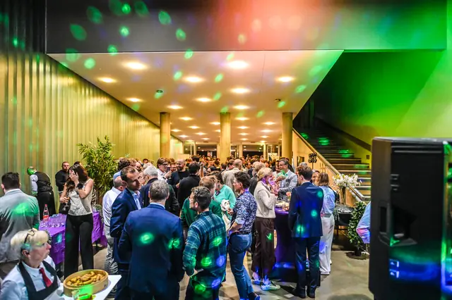 The foyer under coloured lights during the break.