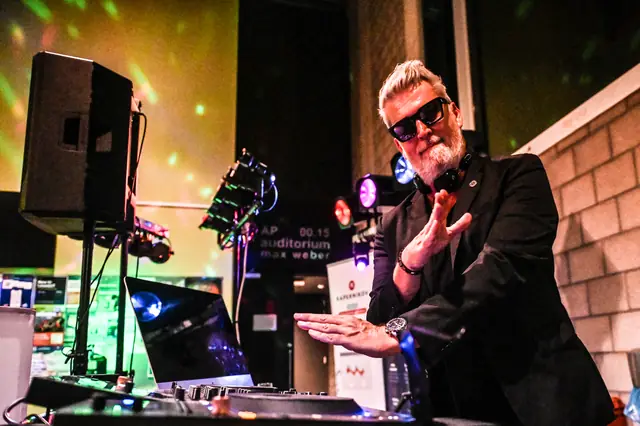 The DJ in sunglasses, mid-set.